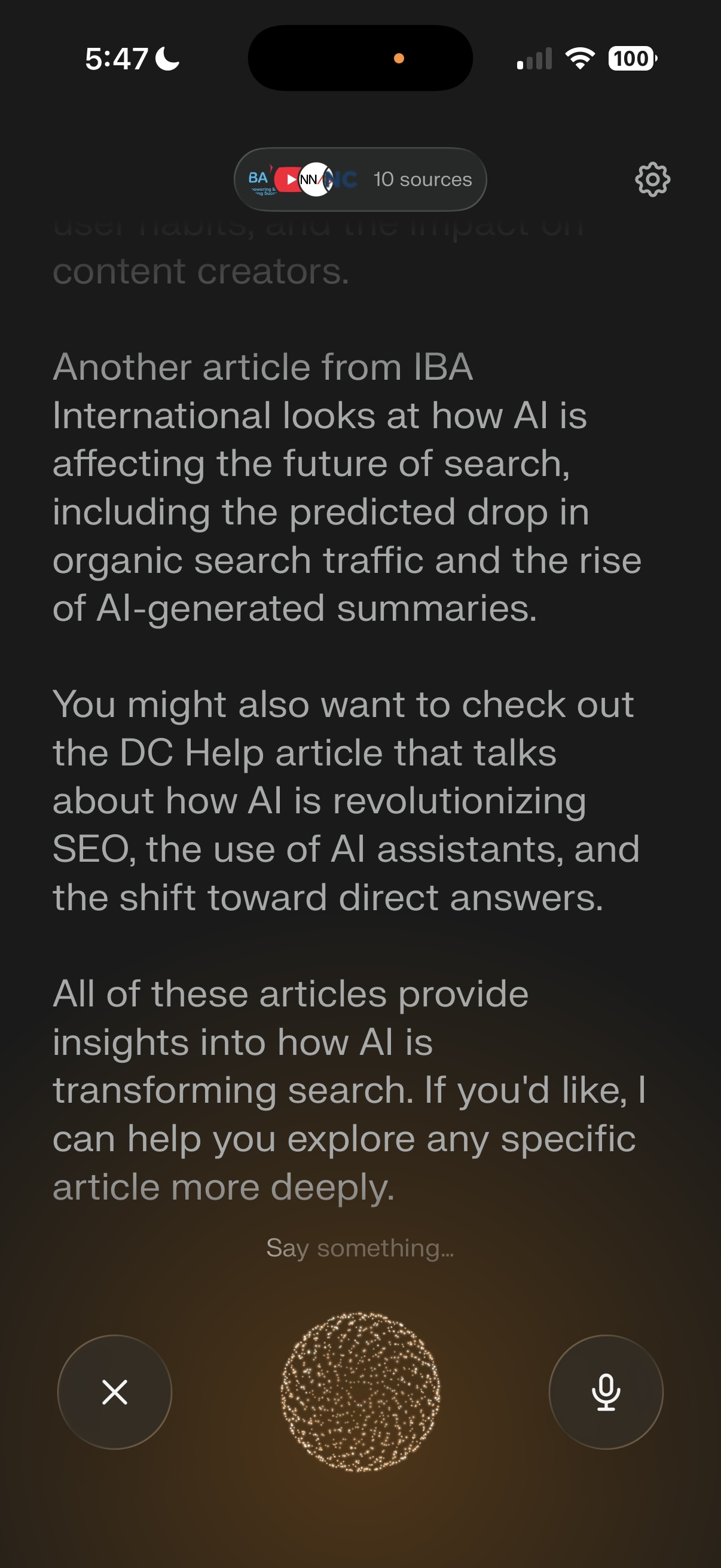 A screenshot of Perplexity's voice search mode on iOS. The app displays a spoken response referencing articles about AI's impact on search, with a "10 sources" indicator at the top. A golden animated orb and microphone button sit at the bottom of the screen, indicating an active voice conversation.